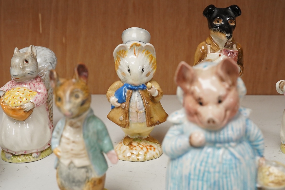 A collection of thirteen Beatrix Potter character figures, stamped with a gold stamp F Warne and Co Ltd, Beswick England, largest 12cm high